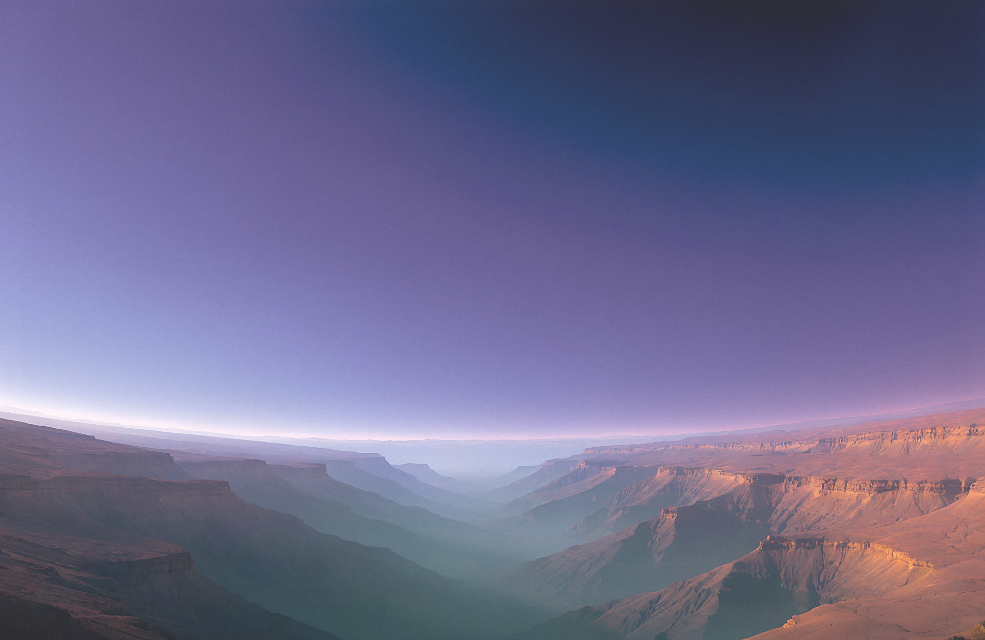 Vast Martian canyon at dusk